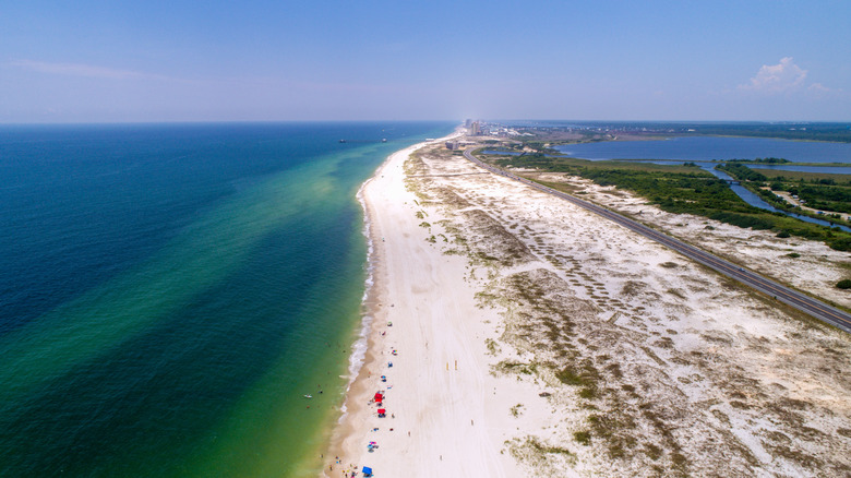 Aerial view of white sand and turquoise ocean in Alabama's Gulf Coast