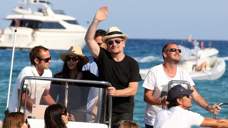 Bono on a boat at Club 55 in Saint-Tropez