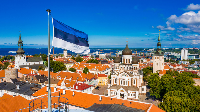 Aerial view of Tallinn, Estonia with Estonian flag in the foreground