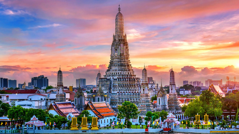 Sunset view of Wat Arun and Bangkok skyline