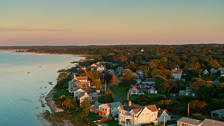 Cape Cod architecture on the shoreline during an autumn sunset