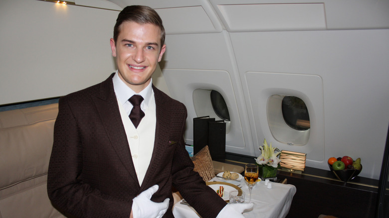 View of butler welcoming guests on Etihad Airways Residence Suite