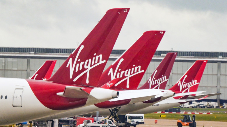 View of Virgin Airlines plane tails at London Heathrow Airport