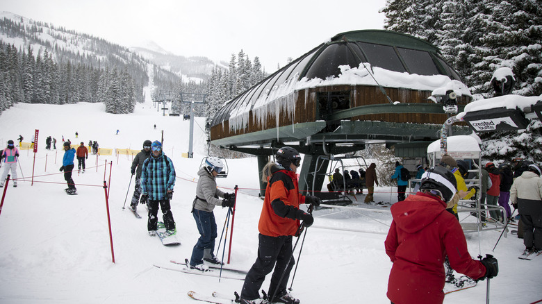 Skiers line up at Crested Butte chairlift