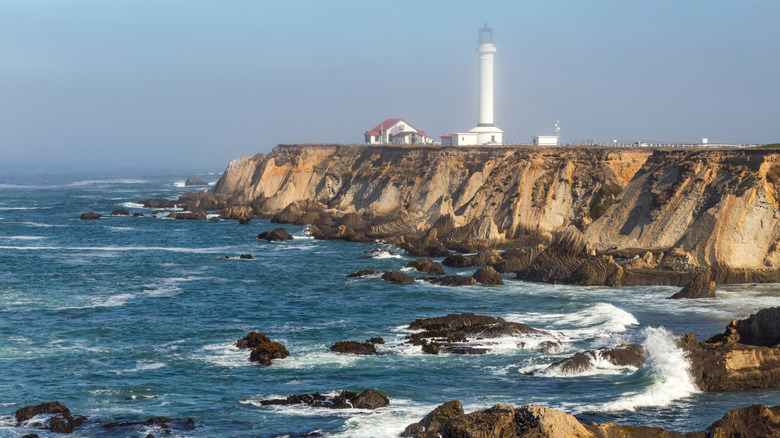The Point Arena Lighthouse on bluffs over the Pacific Ocean near Point Arena, California