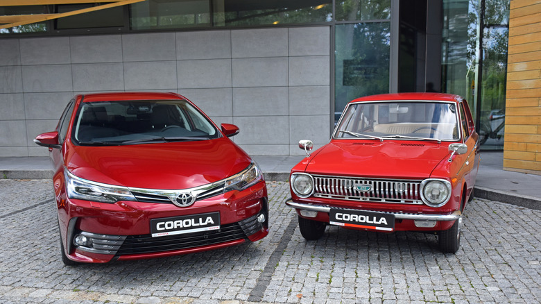 Two red cars from the same make but different models/years
