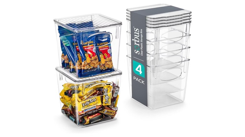 Stacking plastic bins with lids, some holding snacks
