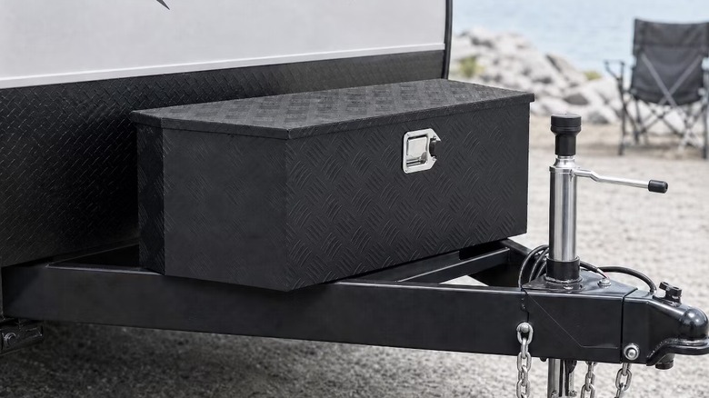 A black, metal trailer tongue box on an RV
