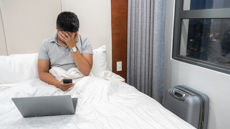 Hotel guest learning about flight delay