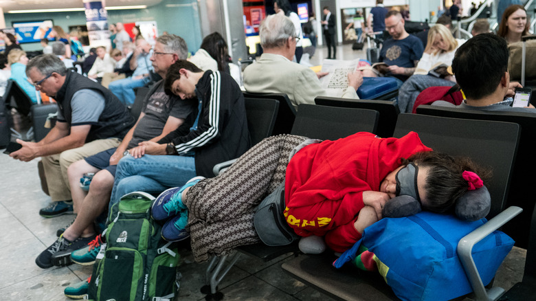 Passengers enduring flight delay at airport