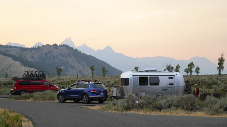 A man sets up his camper at the Gros Ventre Campground in Grand Teton National Park