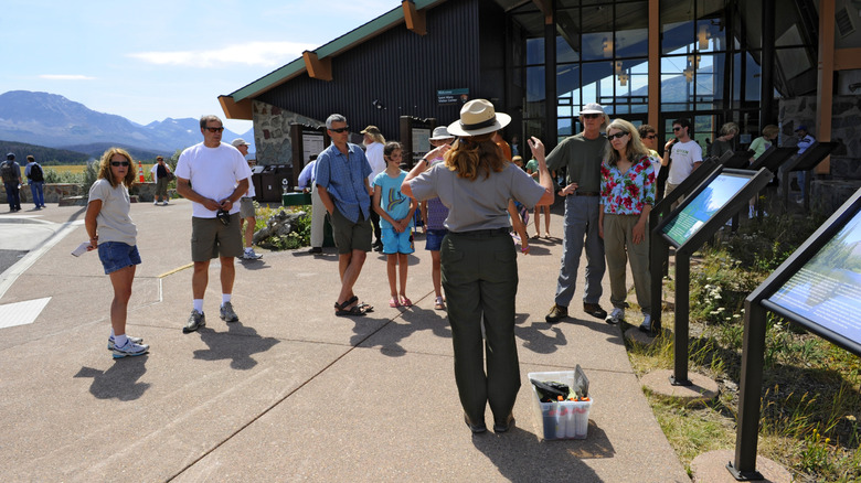 A park ranger talks to visitors at St. Mary Visitor Center in Glacier National Park