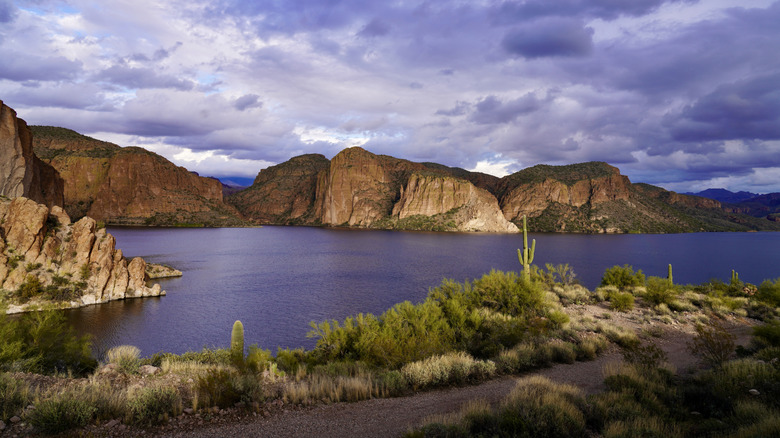 A gravel path by Canyon Lake near Phoenix, Arizona, beneath a cloudy sky