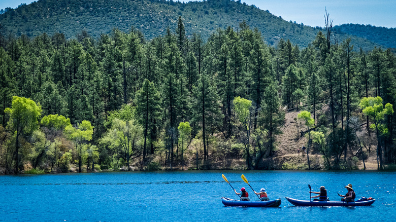 Kayakers paddle across Lynx Lake near Prescott, Arizona