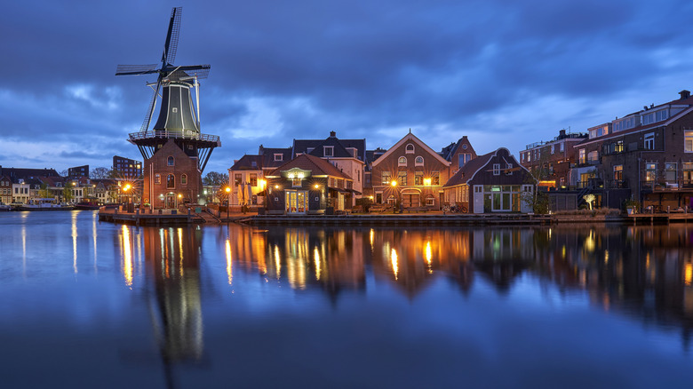 Blue hour along a windmill on a canal in Haarlem, The Netherlands