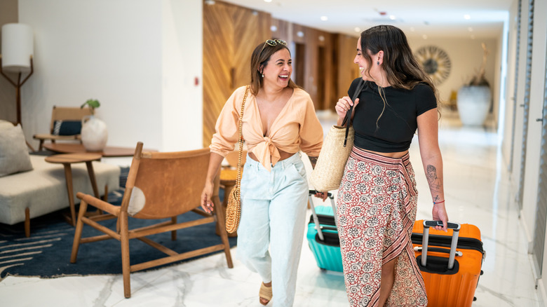 Two women heading to their hotel room