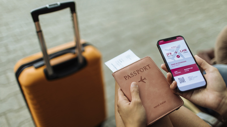 A man looking at his mobile boarding pass