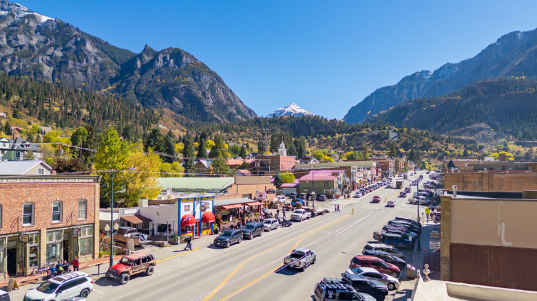 Downtown Ouray in the foreground with the mountains and fall colors in the background