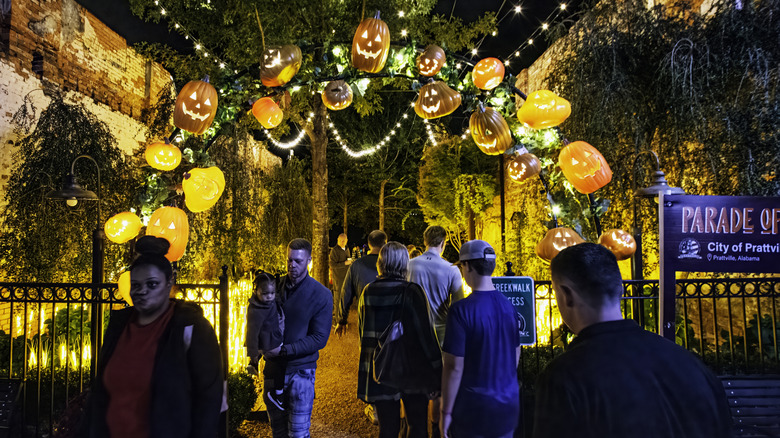 A crowd with pumpkin lights