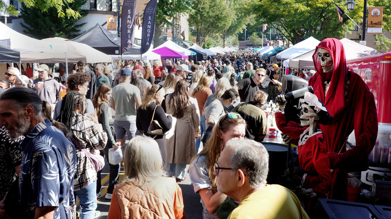 A crowd at a Halloween fair