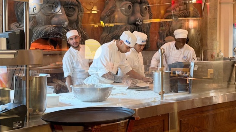 The pizza bakers at Via Napoli Pizzeria in Epcot, Florida