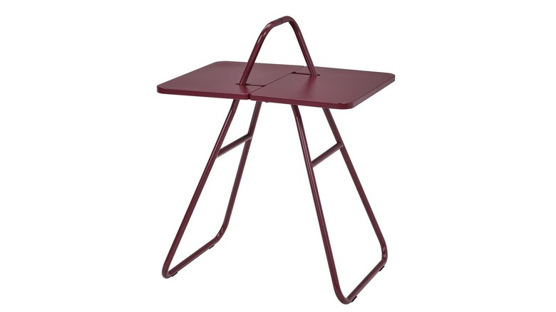 A retro-styled folding table in a maroon color