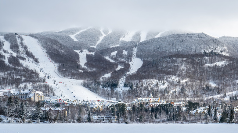 View of Mont-Tremblant ski slopes, a ski village resort nestled in snow-covered mountains