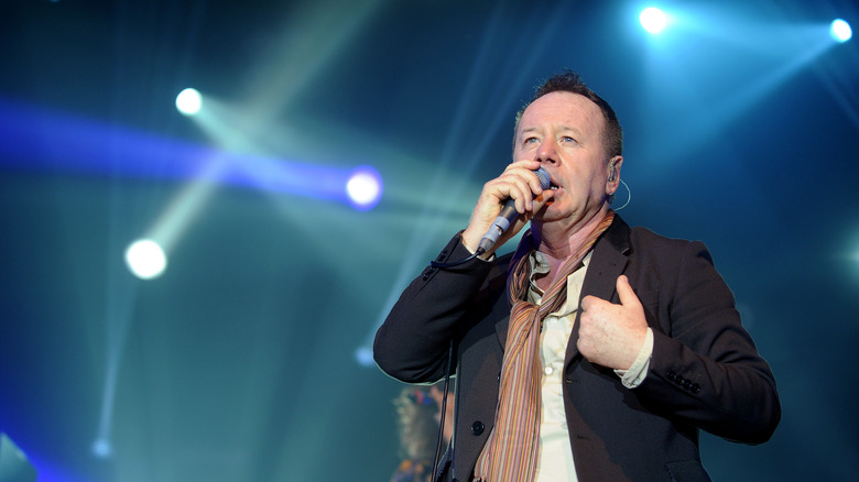 Singer Jim Kerr of the band Simple Minds on stage singing