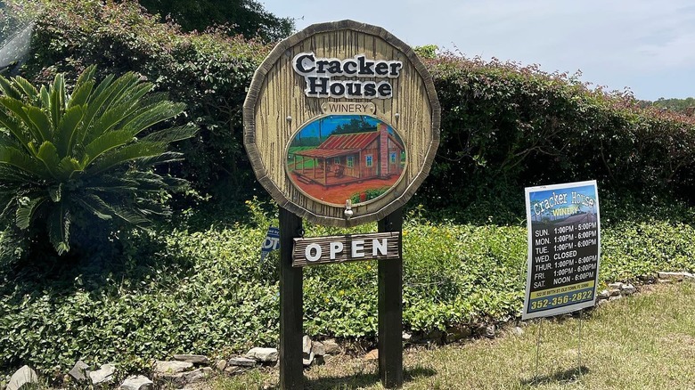 sign otuside that says cracker house winery open