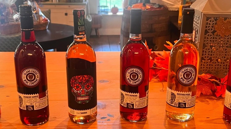four bottles of wine on a table