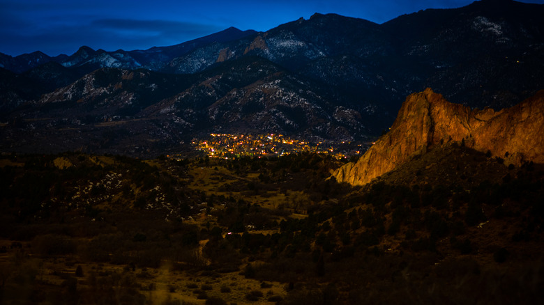 nightime aerial view of small town nestled in mountains
