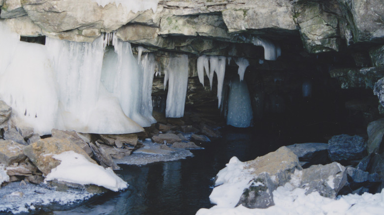 entrace to a cave with frozen water