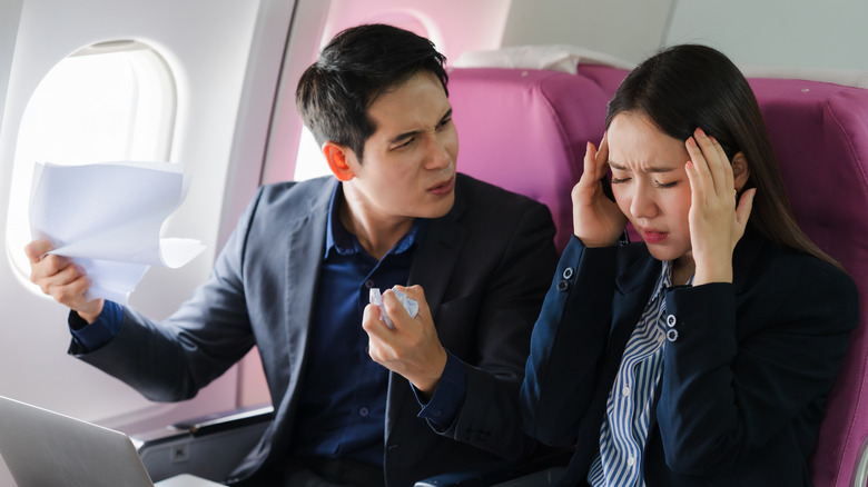 Man yelling at passenger on plane