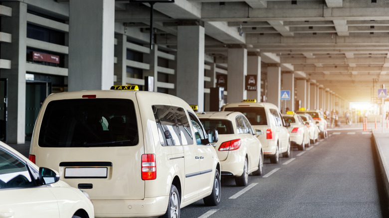 Taxis wait outside airport