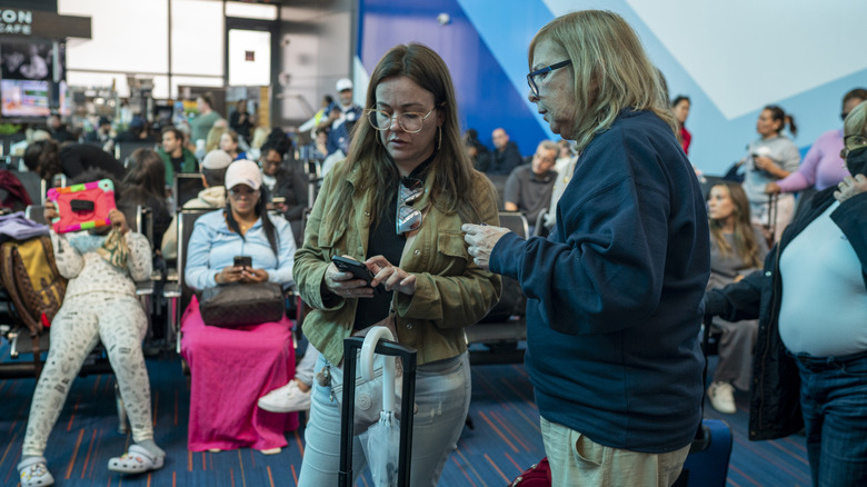 Airport travelers at the gate