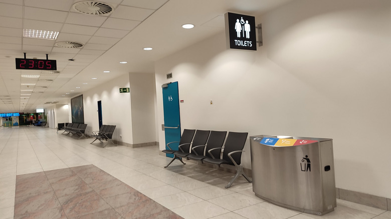Restroom sign at an airport