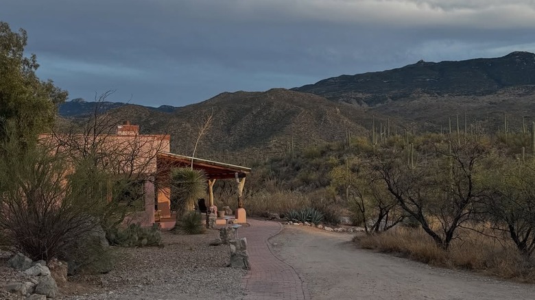 Pink building and surrounding mountains at Tanque Verde Ranch