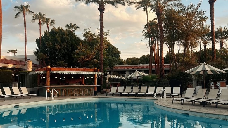Seats and bar around pool at The Scott Resort and Spa