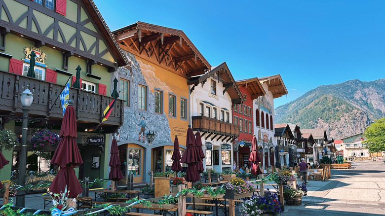 Ornate Bavarian facades line a streeting leading to the mountains, Leavenworth, Washington