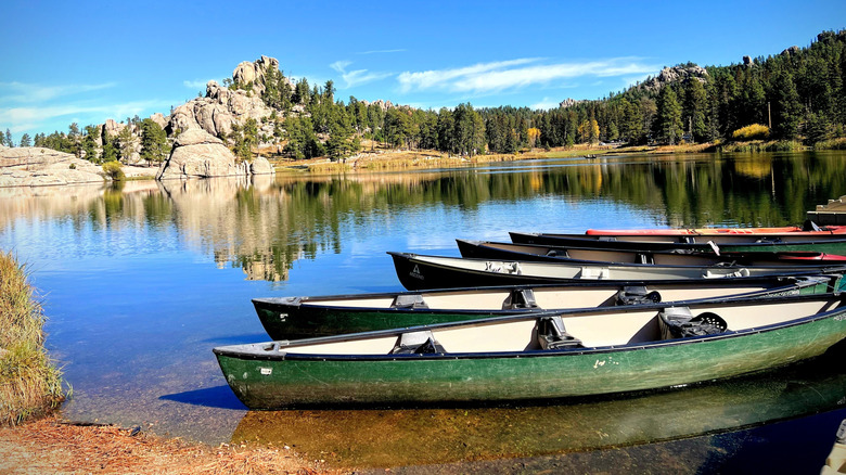 Canoes sit along the edge of Sylvan Lake in Custer State Park, South Dakota