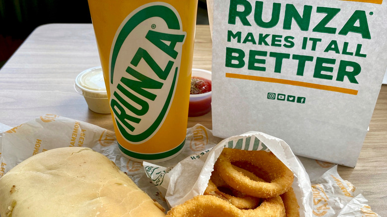 A runza sandwich, onion rings, and drink at a Runza location in Omaha, Nebraska