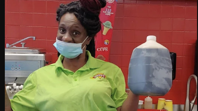 An employee  with a jug of Ward's homemade root beer at Ward's in Hattiesburg, Mississippi