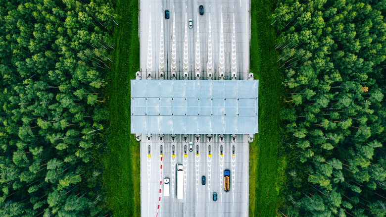 Aerial drone view of a freeway with toll collection point