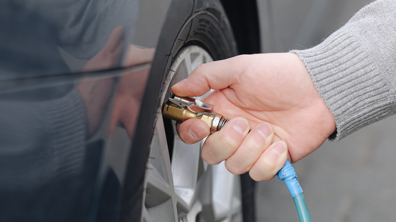 Inflating a car tire with air compressor