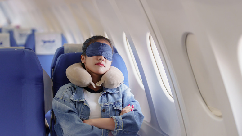 Passenger sleeping on plane