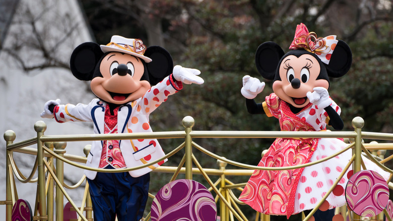 Mickey and Minnie Mouse on a parade float at Tokyo Disney