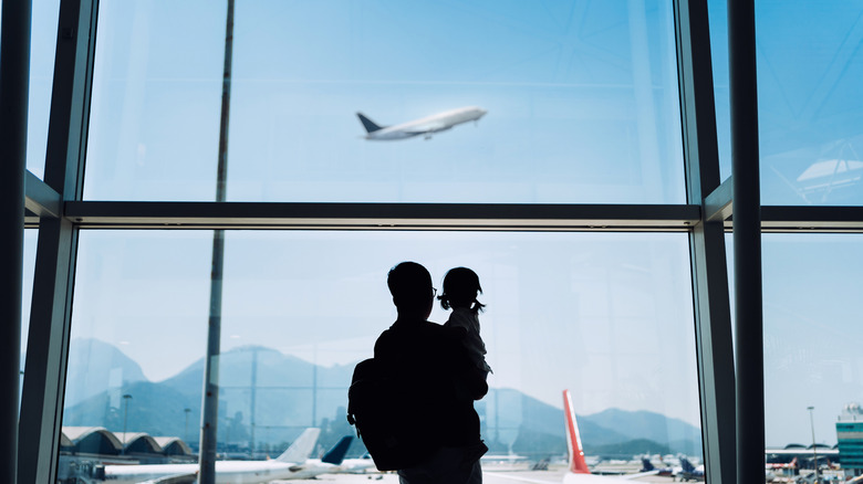 People watching planes at airport