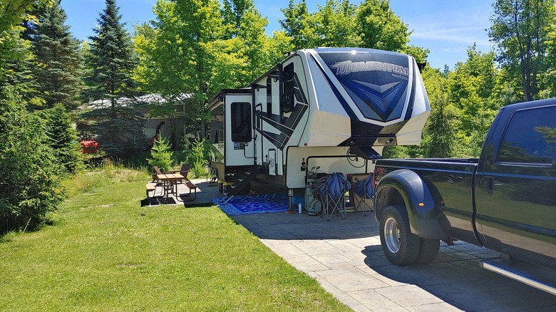 A large camper trailer parked at Indigo Bluffs RV Park & Resort, Empire, Michigan