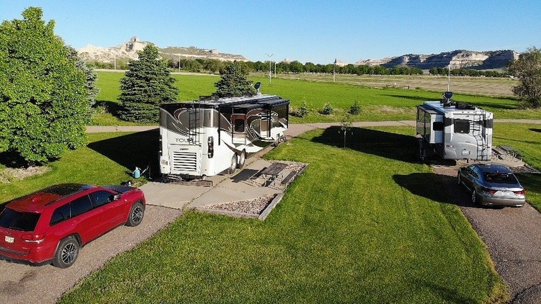 An elevated view of two motorhomes parked at Robidoux RV Park in Gering, Nebraska
