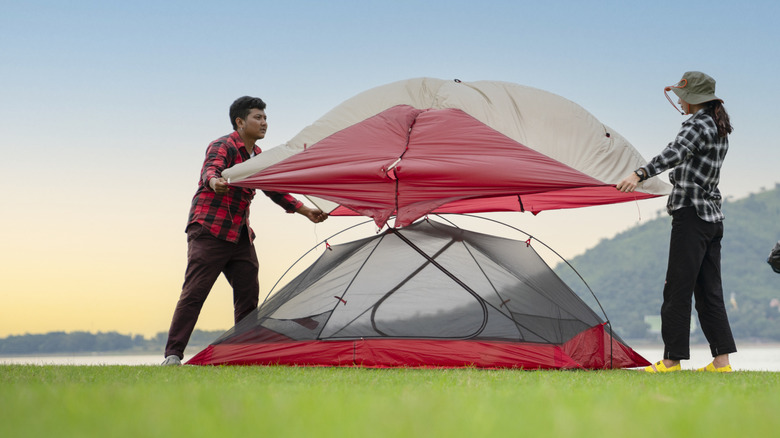 Campers setting up the tent